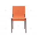 Orange saddle leather armless dining chairs